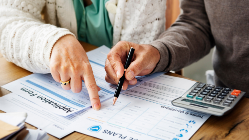 two people reviewing health insurance plans