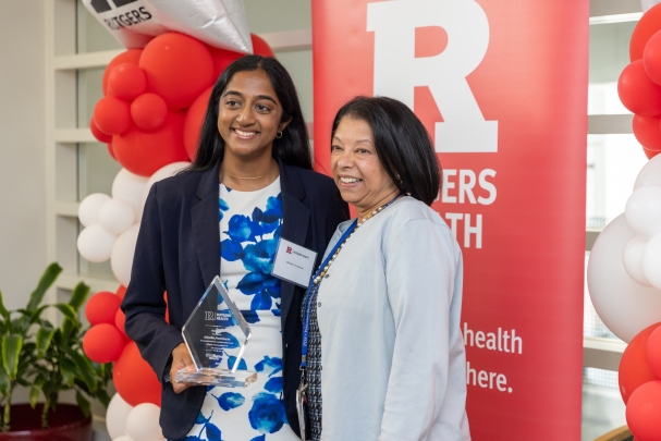 Attendees take photos with awards at the rising stars ceremony.