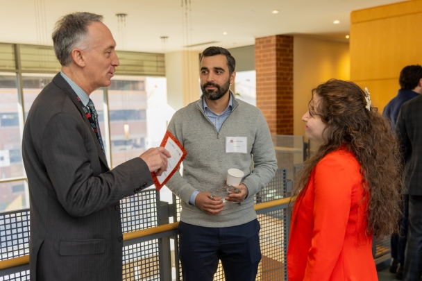 Attendees talk in groups at the rising stars ceremony.