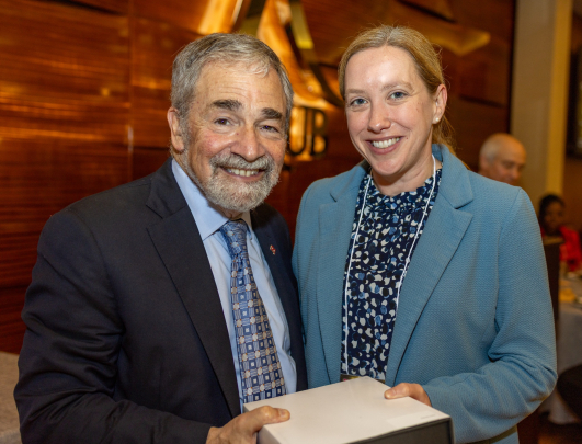 Chancellor Strom and Katie Devine, recipient of the Excellence in Clinical or Health Sciences Research Award – Mid-Career Investigator.